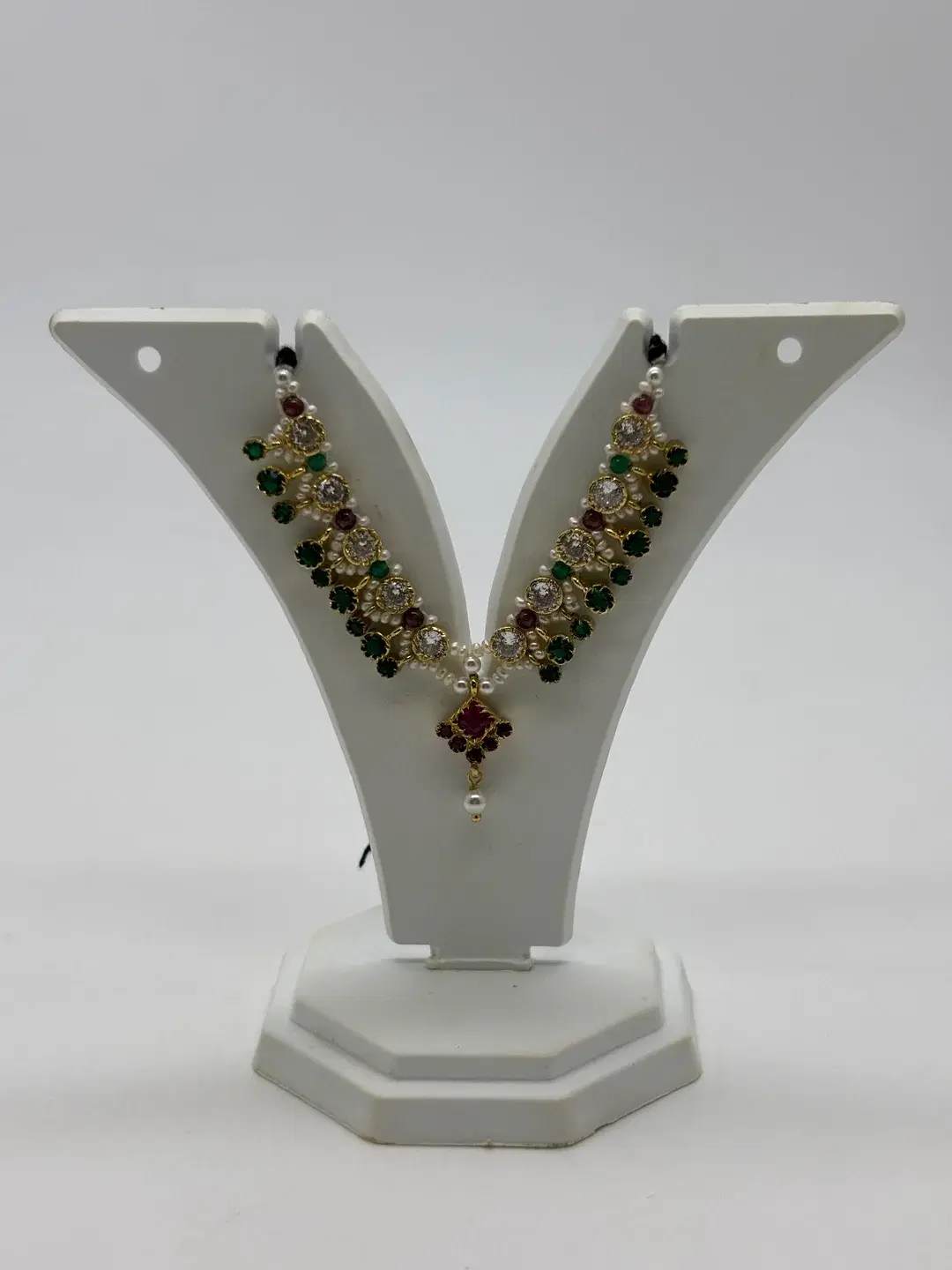 Freshwater pearl haar with circular AD settings, ruby and emerald drop beads, and silver pendant for Laddu Gopal