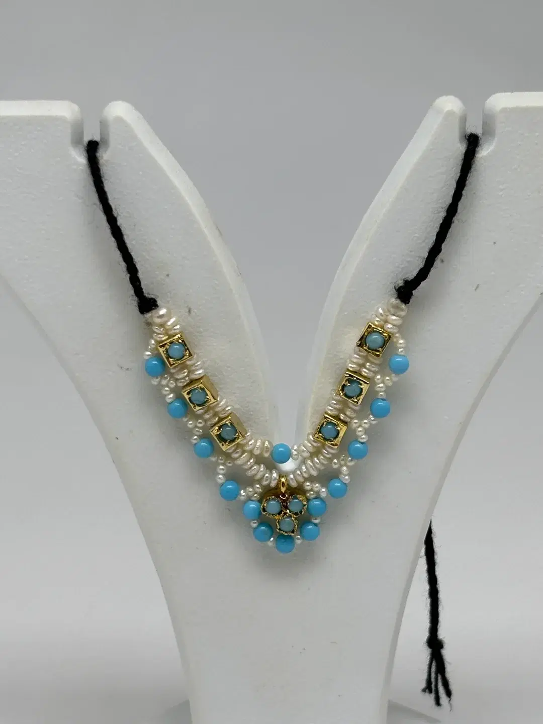 Turquoise and freshwater rice pearl mala with square silver chowkis and trefoil pendant for Laddu Gopal