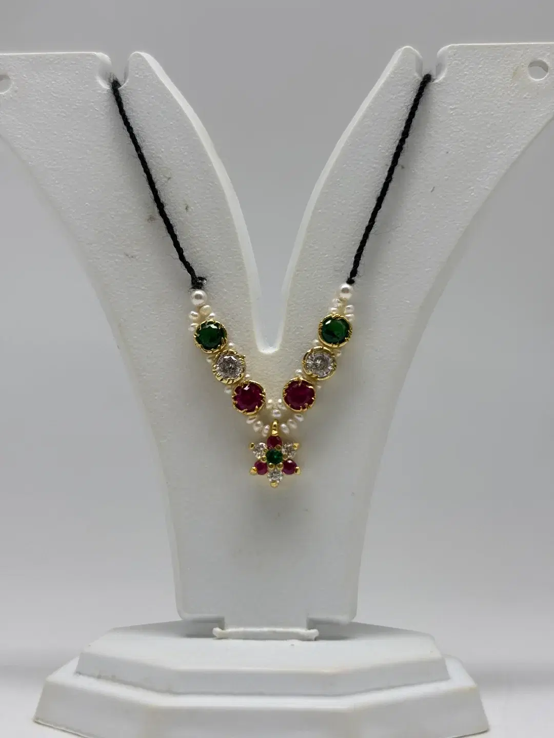 Single-strand freshwater pearl mala with silver bezel-set gems and floral rosette pendant for Laddu Gopal