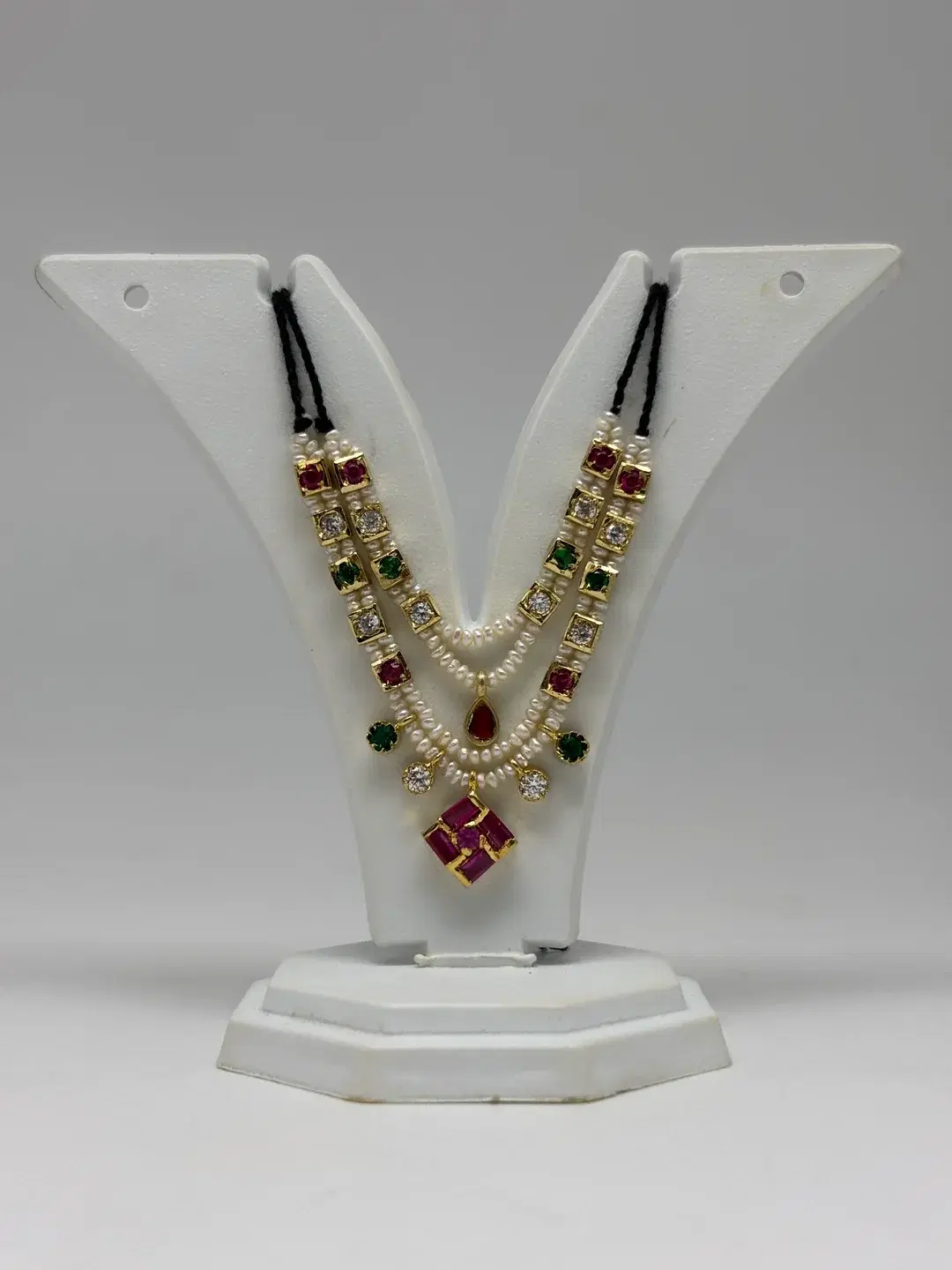 Grand double-row freshwater pearl haar with gem-set silver chowkis and ruby padak pendant for Laddu Gopal
