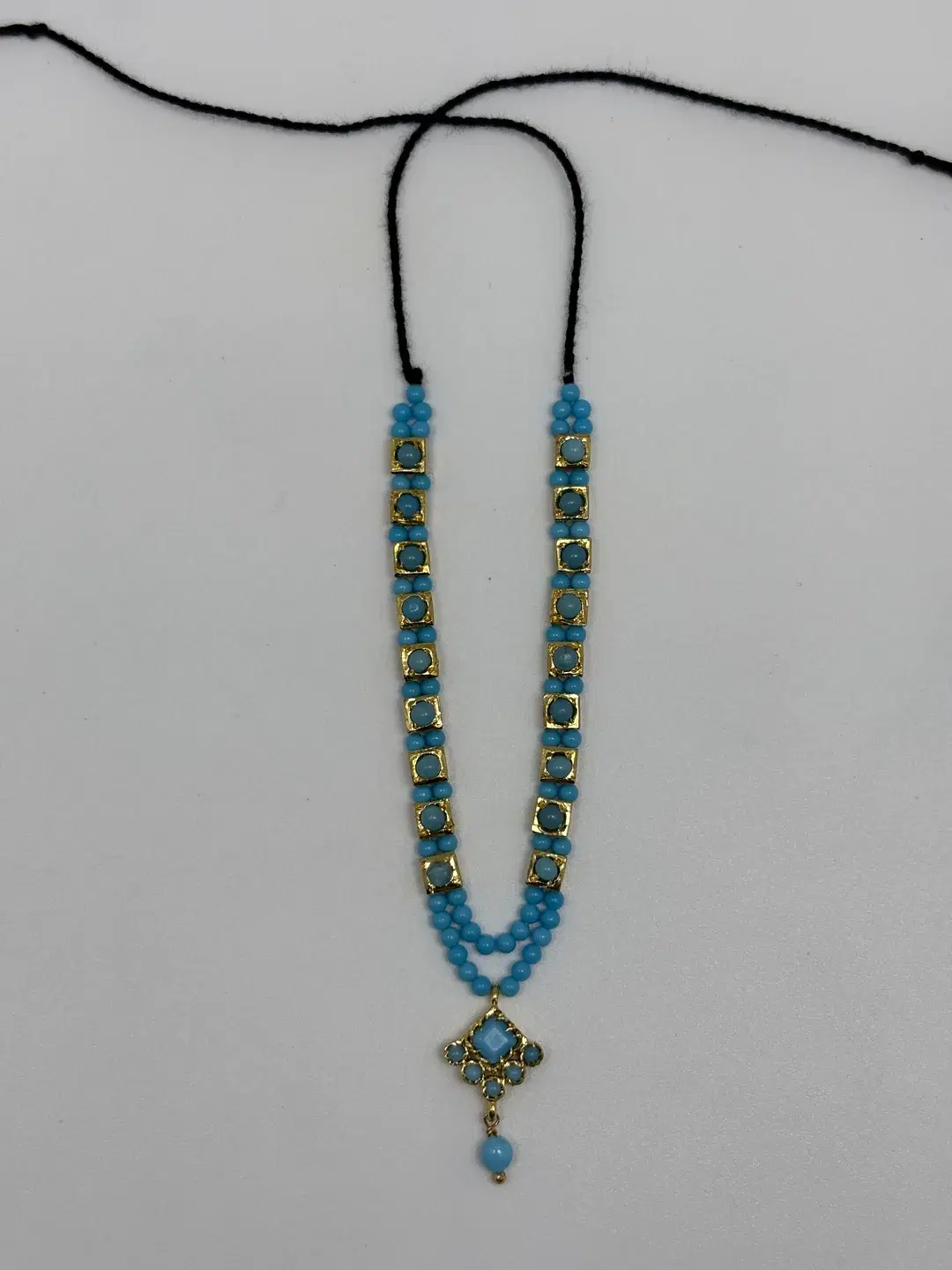 Long turquoise phiroza bead haar with rectangular silver chowkis and diamond padak pendant for Laddu Gopal